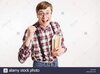 Portrait of an excited young school nerd guy holding book and celebrating  isolated over white background Stock Photo - Alamy