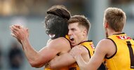 Jai-Newcombe-and-Dylan-Moore-celebrate-a-goal-during-the-R10-clash-between-Hawthorn-and-Brisba...jpg