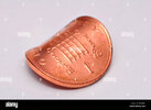 bent-copper-one-penny-coin-BYGH8H.jpg