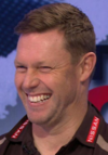 sam mitchell shit eating grin.png