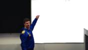mini pointing at board t.png