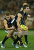 clinton-young-of-the-magpies-gets-tackled-by-david-mckay-of-the-crows-picture-id173337912.jpeg