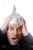 106806681-crazy-scared-man-wearing-tin-foil-hat-paranoia-or-conspiracy-theory-concept.jpg