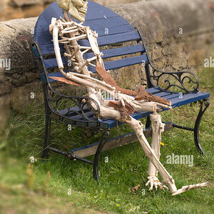 skeleton-sitting-on-bench-seaton-sluice-northumberland-GRKG5T.jpg