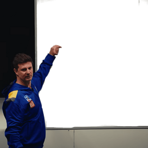 mini pointing at board t.png