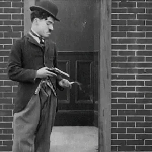 Charlie Chaplin shooting.gif