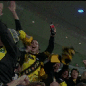 GuyInCrowdSeeminglyGivingSomeAdviceToALionsSupporterOrCoachViaHandAndFingerMovements.gif